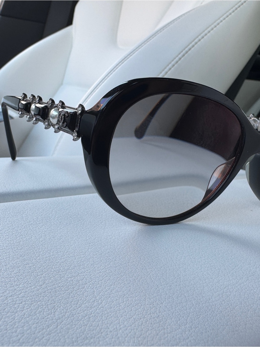 CHANEL Black Round Sunglasses with Silver Chain Temple Accents